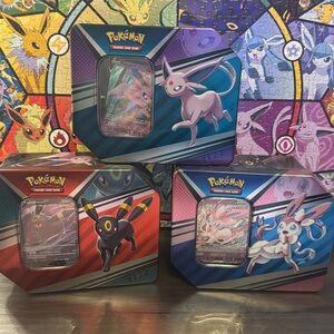 Pokémon Tins, empty besides cards shown